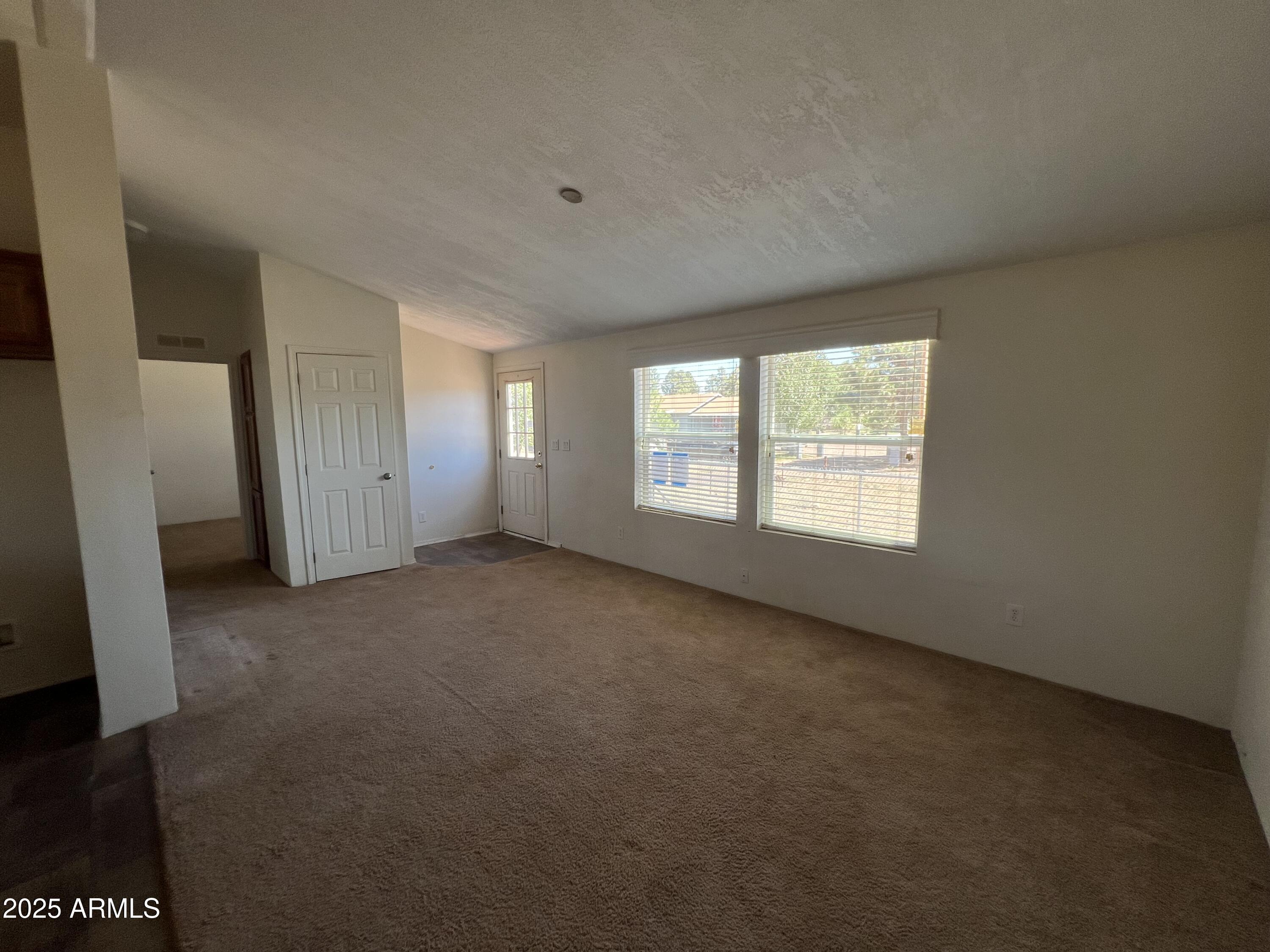 2122 Meadow Lane Overgaard, AZ 85933 - Photo 7 of 19 an empty room with a window