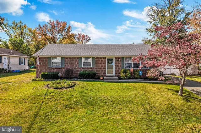 a view of a house with swimming pool and a yard
