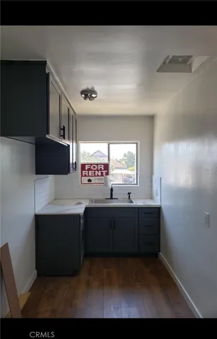 a view of kitchen with stainless steel appliances granite countertop a sink and a stove