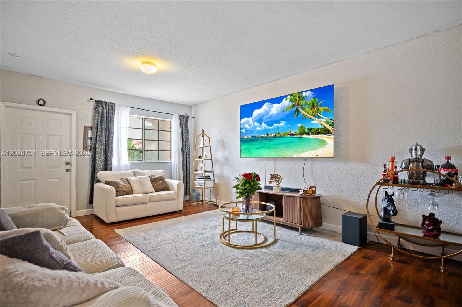 255 East 3rd Street, Unit 1 Hialeah, FL 33010 - Photo 13 of 38 a living room with furniture and a flat screen tv
