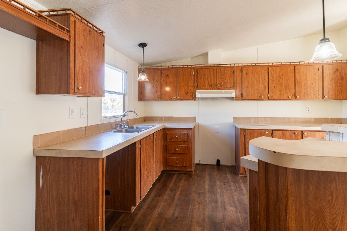 404 South Mill Street Flatonia, TX 78941 - Photo 11 of 34 a kitchen with sink cabinets and window