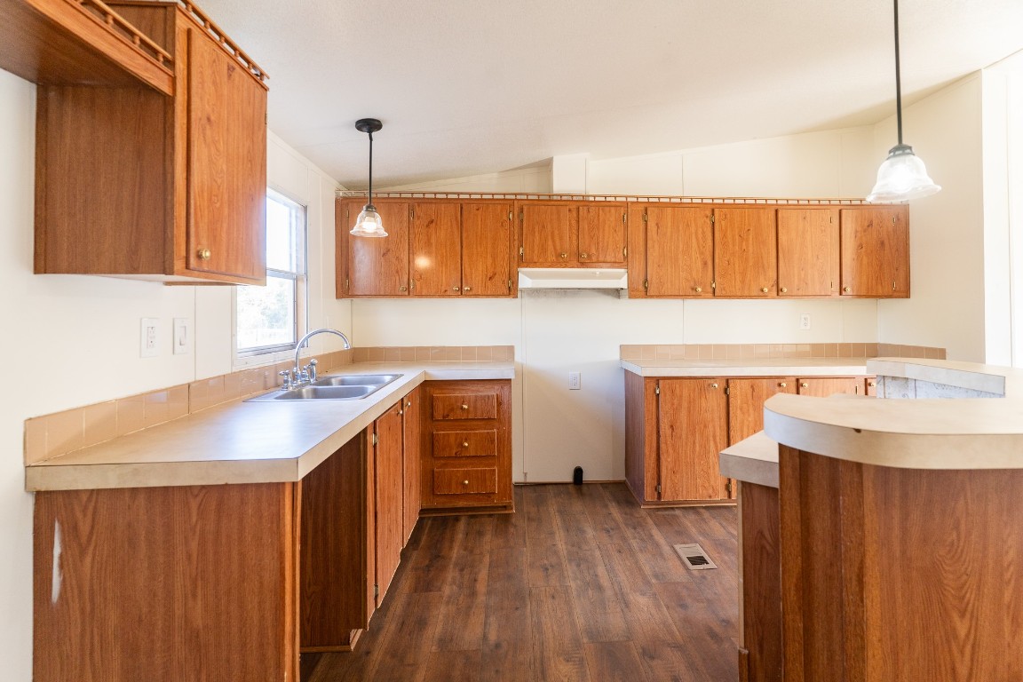 404 South Mill Street Flatonia, TX 78941 - Photo 12 of 34 a kitchen with a sink stove and cabinets