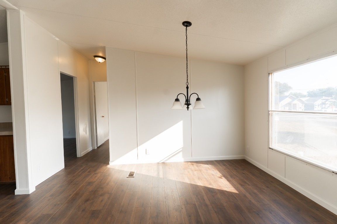 404 South Mill Street Flatonia, TX 78941 - Photo 14 of 34 a view of empty room with wooden floor and window