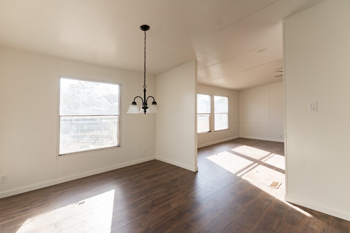 404 South Mill Street Flatonia, TX 78941 - Photo 16 of 34 a view of an empty room with wooden floor and a window