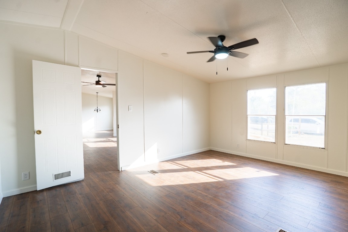 404 South Mill Street Flatonia, TX 78941 - Photo 25 of 34 a view of an empty room with wooden floor and a window