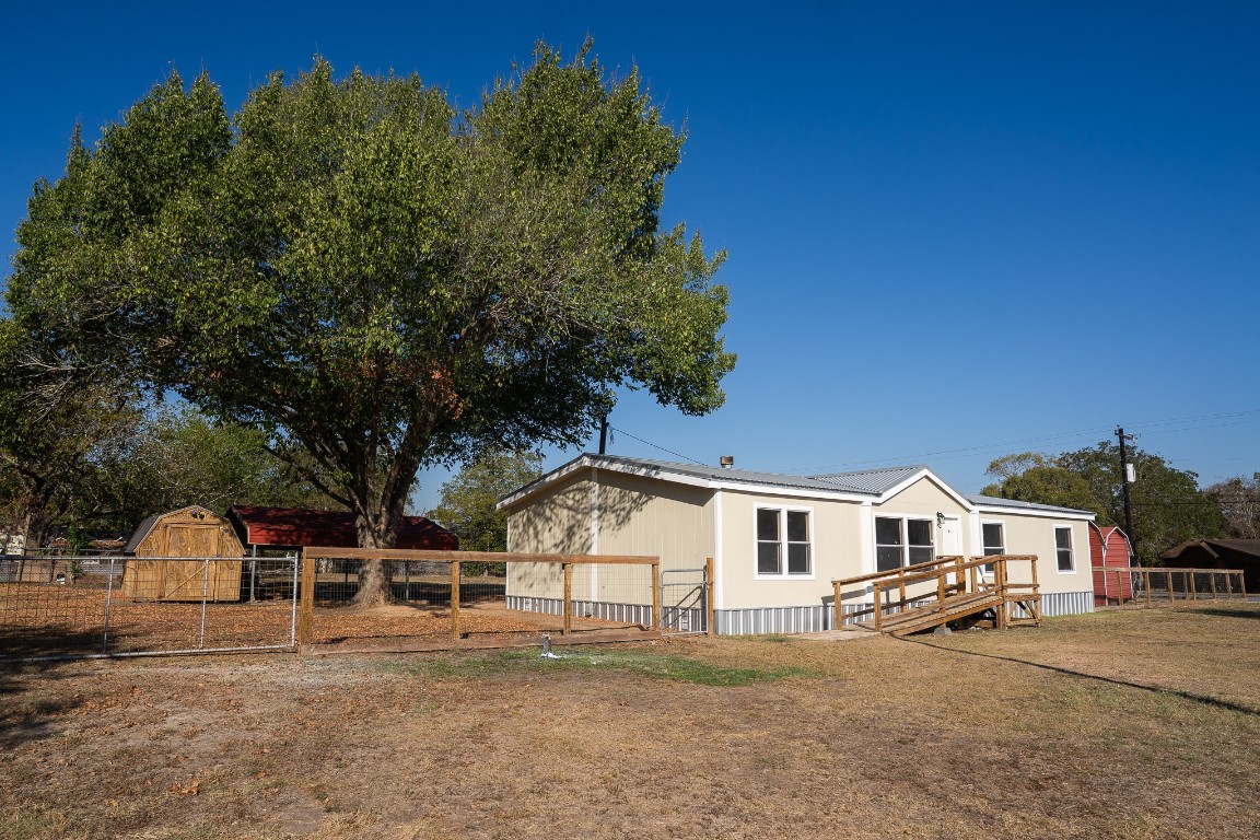 404 South Mill Street Flatonia, TX 78941 - Photo 6 of 34 a front view of a house with a yard and garage