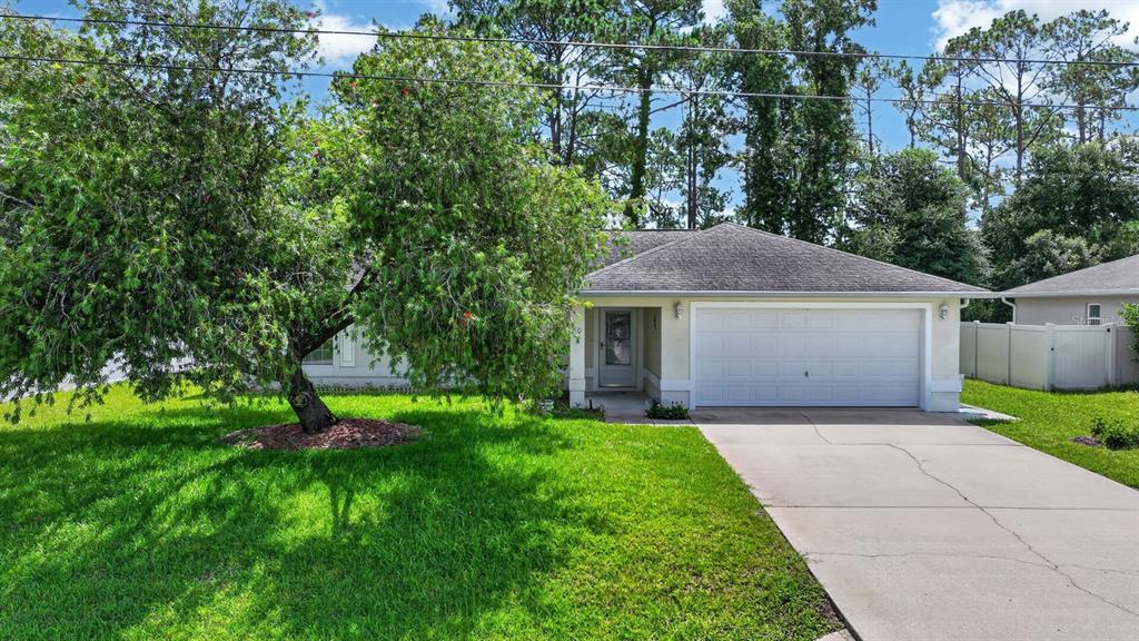80 Roxboro Drive Palm Coast, FL 32164 - Photo 31 of 39 a view of a yard in front of house