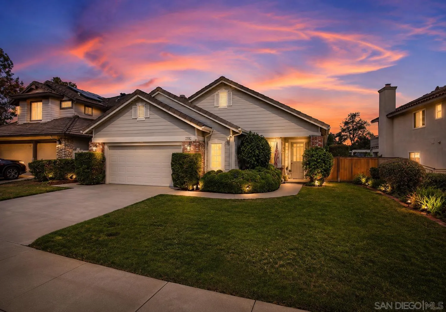 1783 Medinah Road San Marcos, CA 92069 - Photo 1 of 39 a front view of a house with a garden and yard