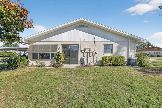 a front view of a house with a yard and porch