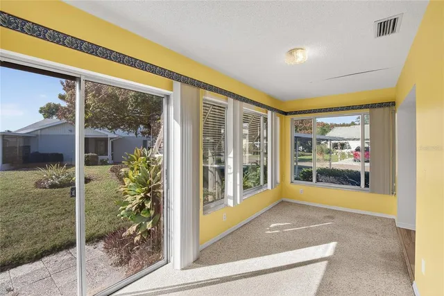 a living room with glass door