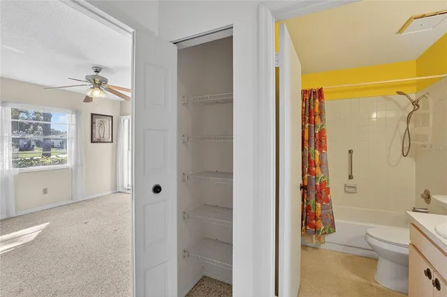 a bathroom with a shower a sink and a toilet