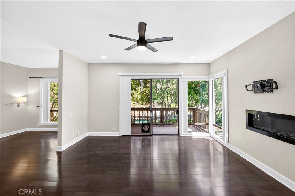 9 Madrona Irvine, CA 92612 - Photo 13 of 38 a view of empty room with wooden floor and fan