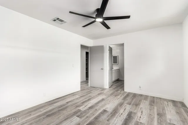 a view of a room with a sink and a white cabinet