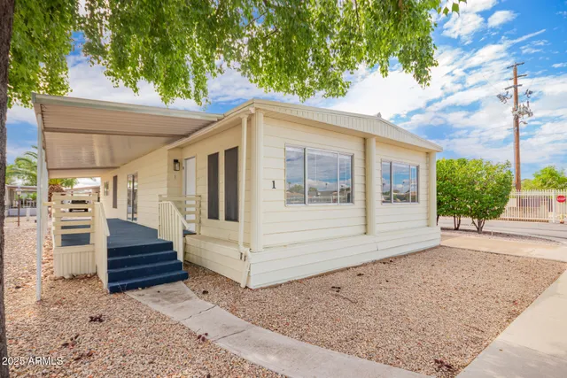 a view of a couches in the back yard of the house