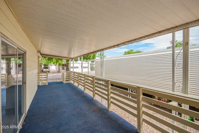 a view of a balcony with chairs
