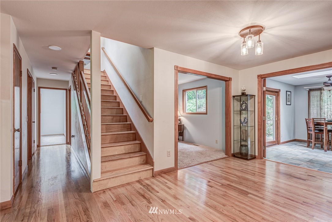 20600 2nd Avenue Southwest Normandy Park, WA 98166 - Photo 12 of 40 a view of a hallway with wooden floor and staircase