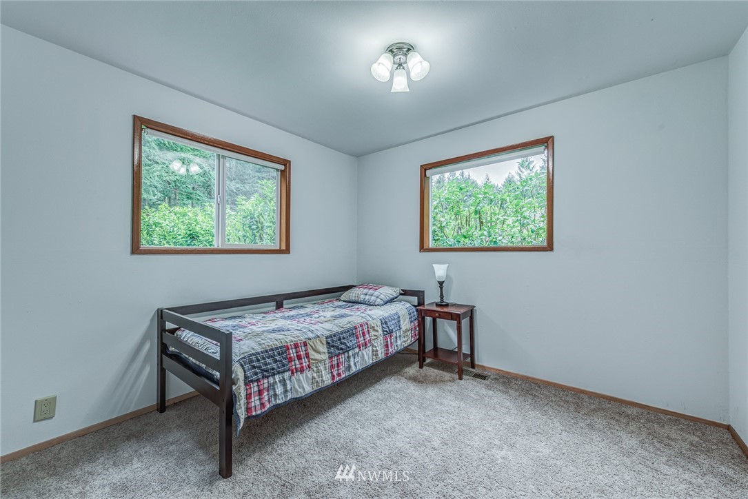 20600 2nd Avenue Southwest Normandy Park, WA 98166 - Photo 14 of 40 a bedroom with a bed and a window