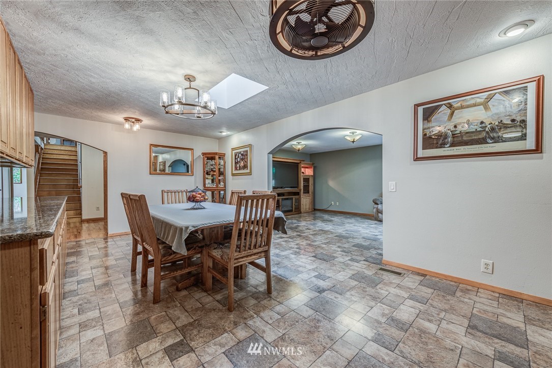 20600 2nd Avenue Southwest Normandy Park, WA 98166 - Photo 19 of 40 a view of a dining room with furniture and chandelier