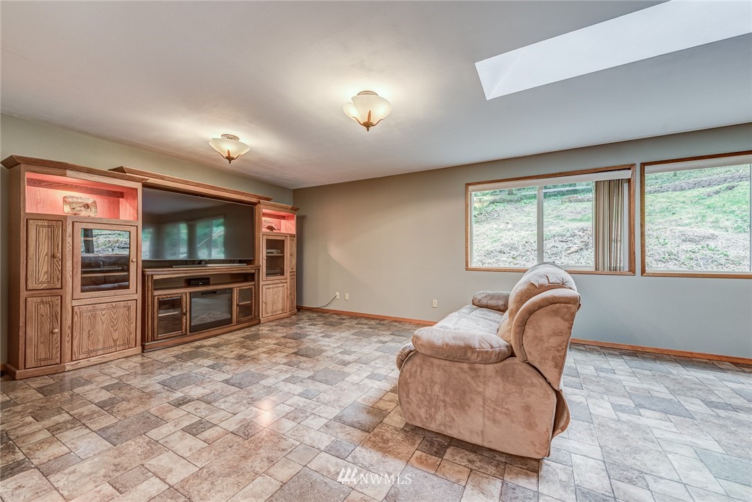 20600 2nd Avenue Southwest Normandy Park, WA 98166 - Photo 20 of 40 a living room with furniture and a flat screen tv