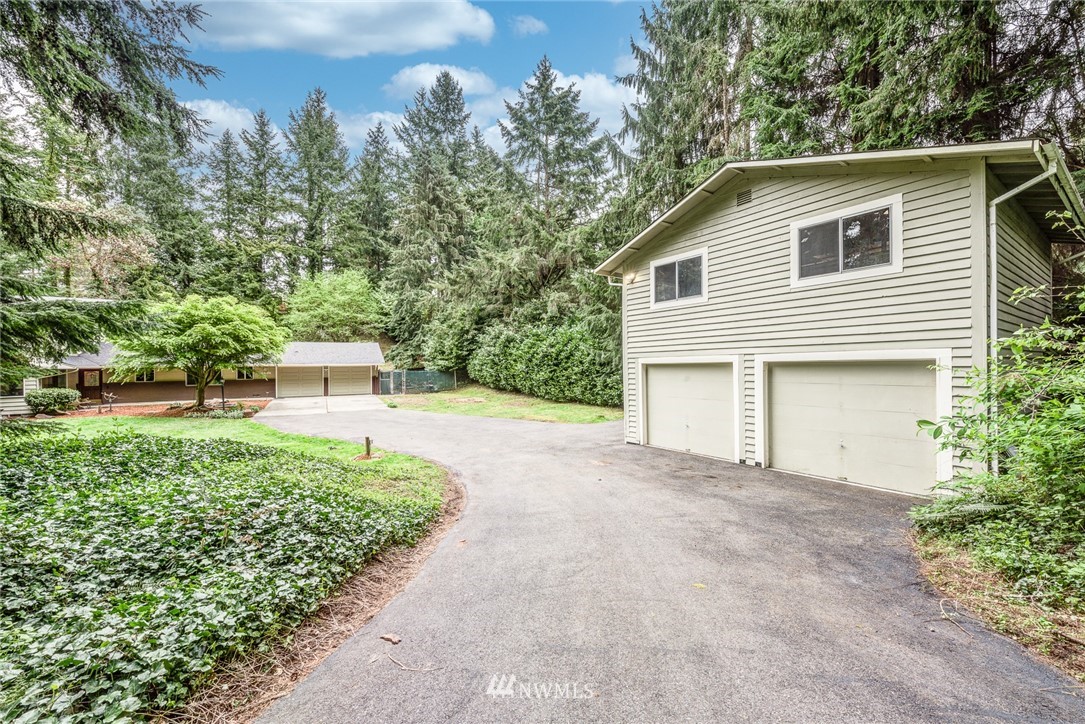 20600 2nd Avenue Southwest Normandy Park, WA 98166 - Photo 3 of 40 a front view of a house with a yard and garage
