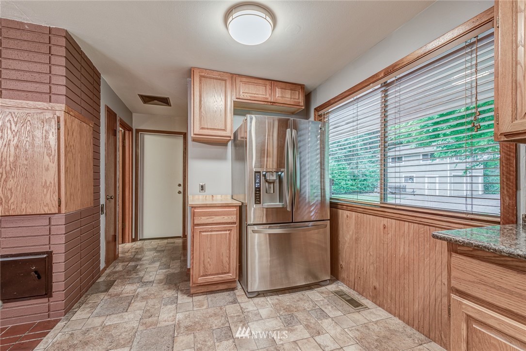 20600 2nd Avenue Southwest Normandy Park, WA 98166 - Photo 24 of 40 a kitchen with stainless steel appliances granite countertop a refrigerator and a sink