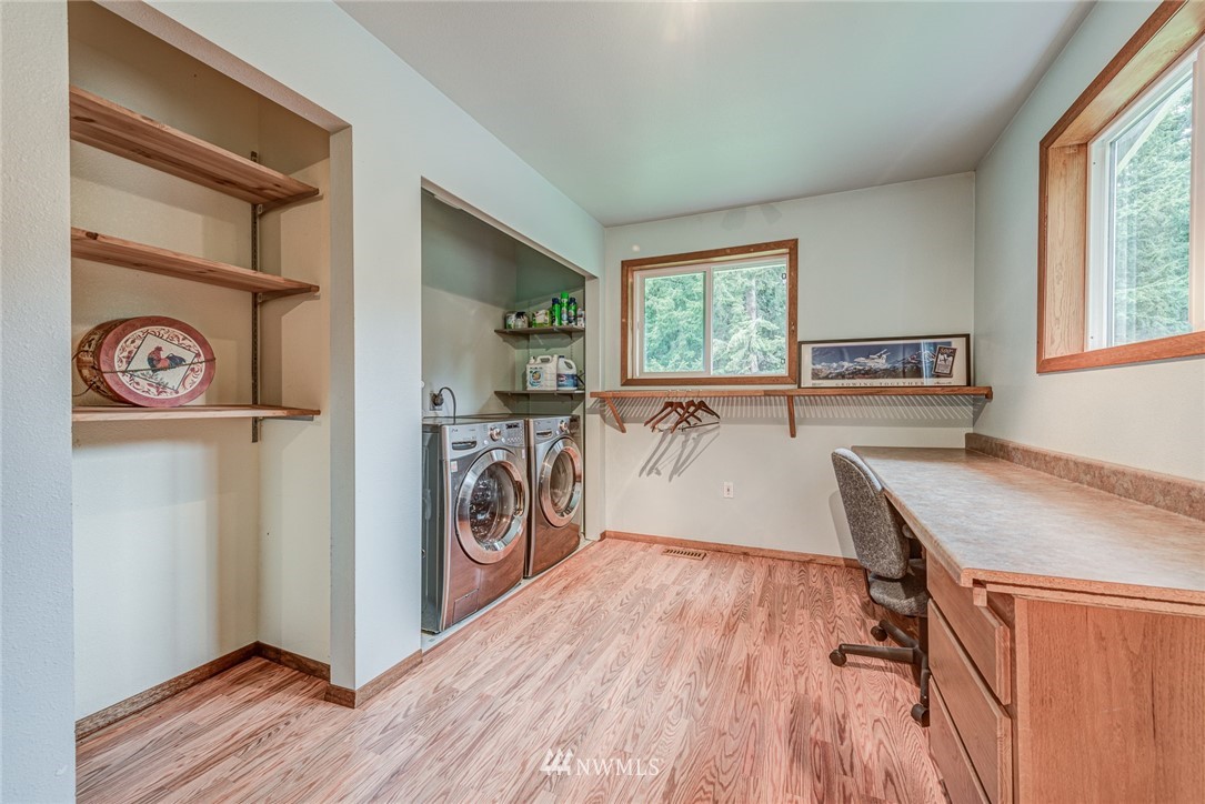 20600 2nd Avenue Southwest Normandy Park, WA 98166 - Photo 26 of 40 a view of a kitchen with fridge and wooden floor