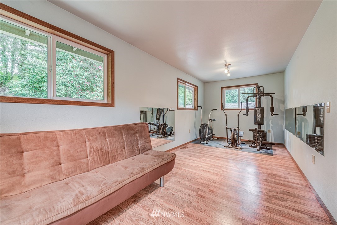 20600 2nd Avenue Southwest Normandy Park, WA 98166 - Photo 27 of 40 a living room with furniture and large windows