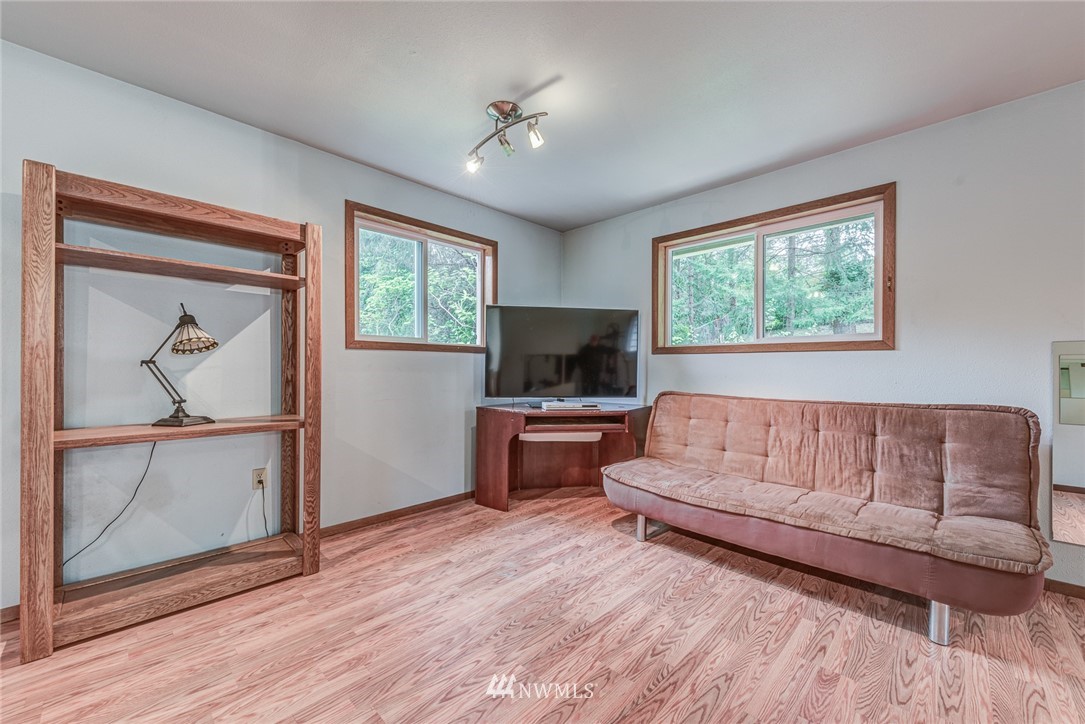 20600 2nd Avenue Southwest Normandy Park, WA 98166 - Photo 28 of 40 a living room with furniture and a flat screen tv