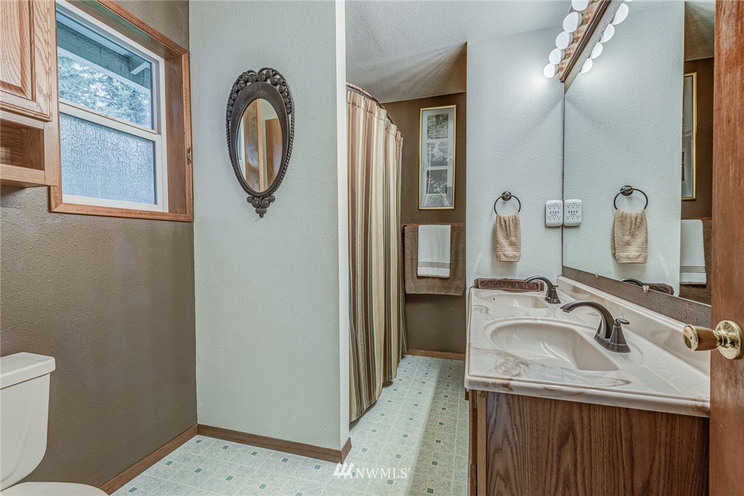 20600 2nd Avenue Southwest Normandy Park, WA 98166 - Photo 29 of 40 a bathroom with a sink and a mirror