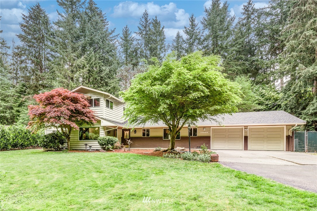 20600 2nd Avenue Southwest Normandy Park, WA 98166 - Photo 4 of 40 a front view of a house with a garden and trees