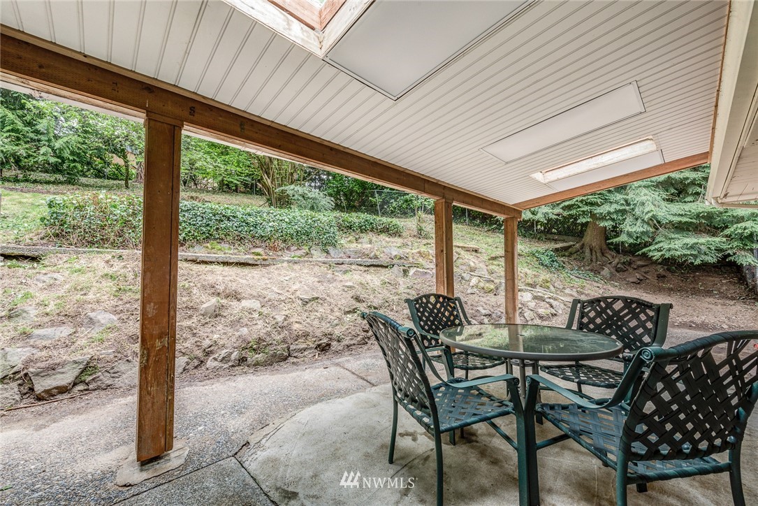 20600 2nd Avenue Southwest Normandy Park, WA 98166 - Photo 33 of 40 a view of an outdoor dining space with furniture and wooden floor