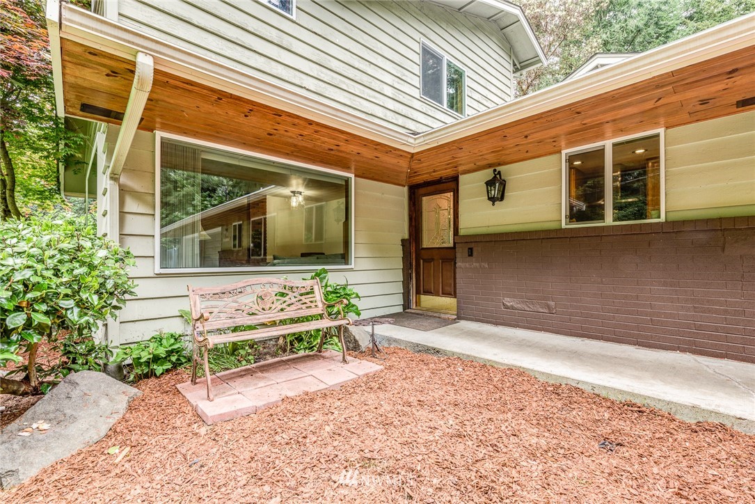 20600 2nd Avenue Southwest Normandy Park, WA 98166 - Photo 5 of 40 a front view of a house with a yard and outdoor seating