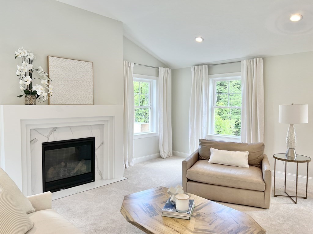 7 Sandy Pond Road Ayer, MA 01432 - Photo 11 of 22 a living room with furniture and a fireplace
