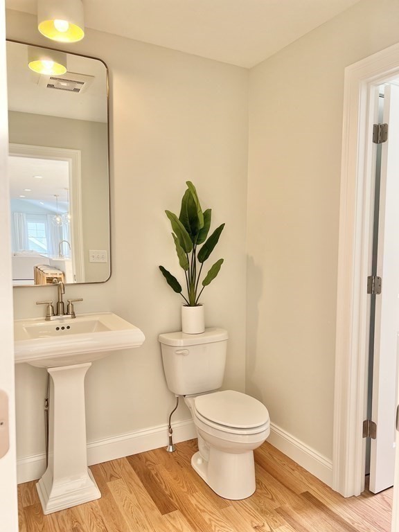 7 Sandy Pond Road Ayer, MA 01432 - Photo 12 of 22 a bathroom with a toilet a sink and a mirror