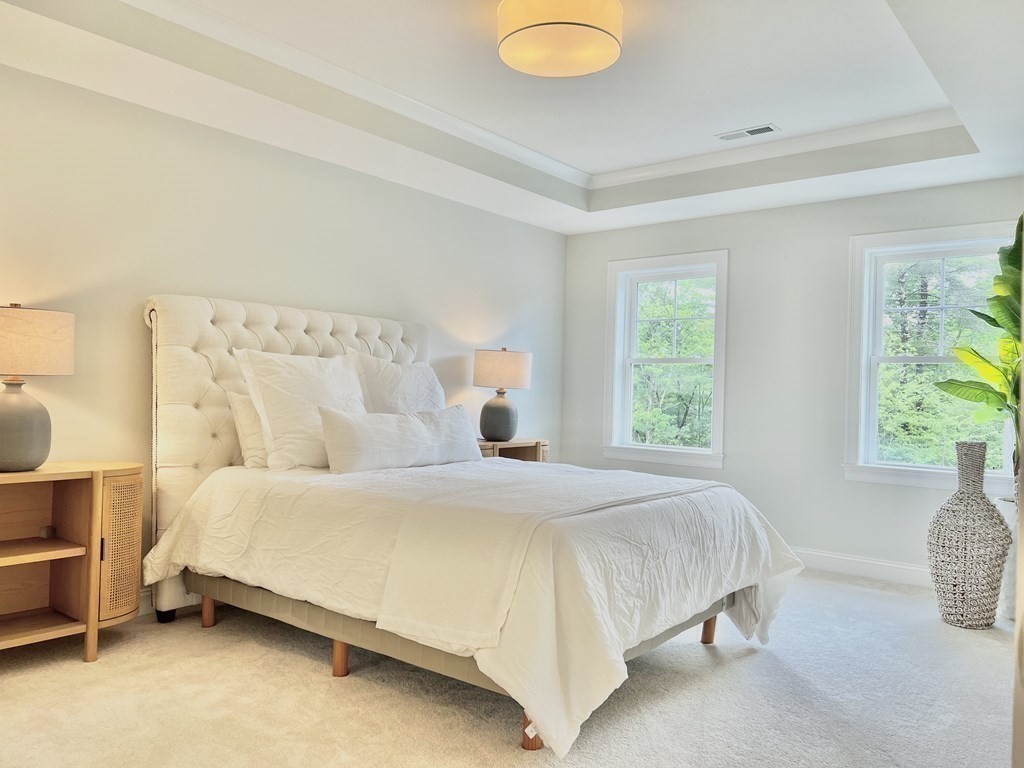 7 Sandy Pond Road Ayer, MA 01432 - Photo 15 of 22 a bedroom with a bed and window