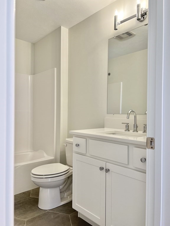 7 Sandy Pond Road Ayer, MA 01432 - Photo 19 of 22 a bathroom with a white toilet sitting next to a bathroom sink