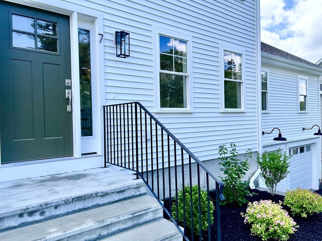 7 Sandy Pond Road Ayer, MA 01432 - Photo 20 of 22 a view of a house with a backyard