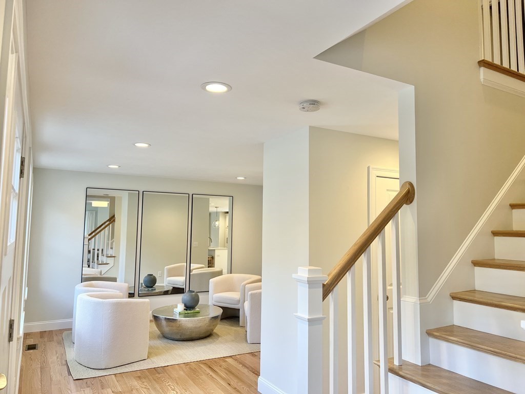 7 Sandy Pond Road Ayer, MA 01432 - Photo 2 of 22 a living room with furniture and a wooden floor