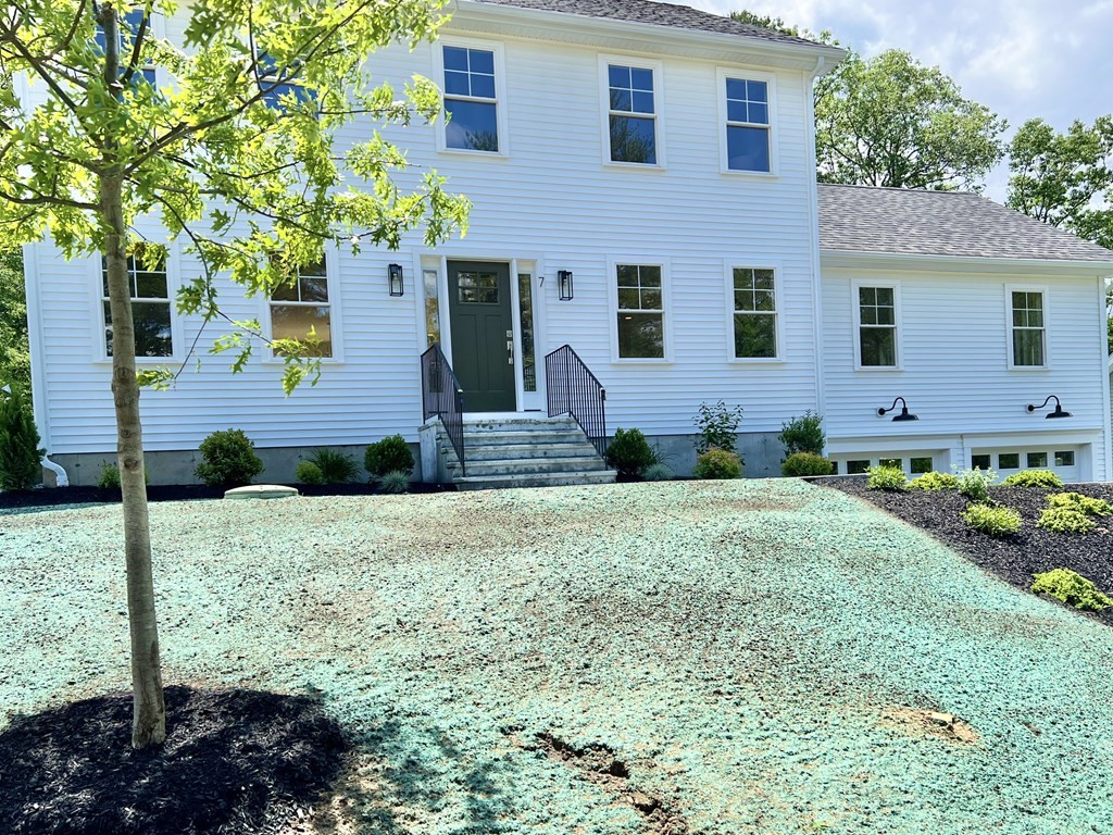 7 Sandy Pond Road Ayer, MA 01432 - Photo 21 of 22 a front view of a house with garden
