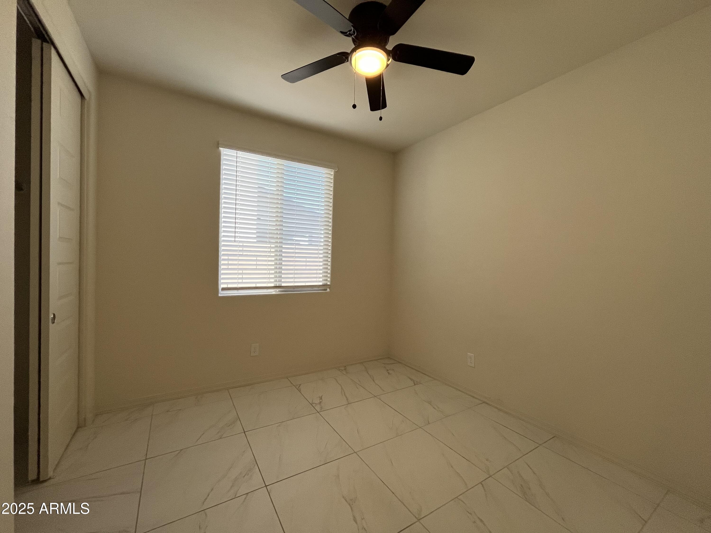 6970 West Gwen Street Laveen, AZ 85339 - Photo 15 of 30 a view of an empty room with a window