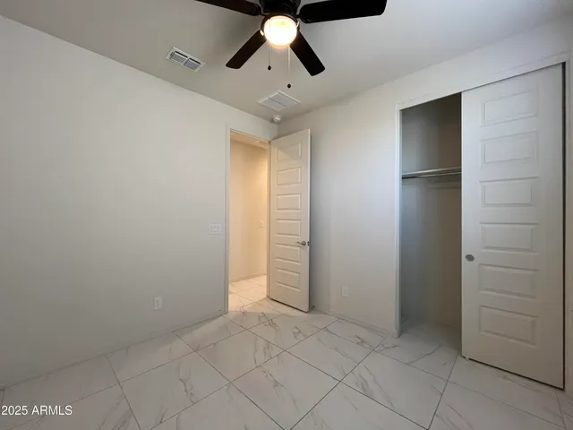 a bathroom with a double vanity sink toilet and shower