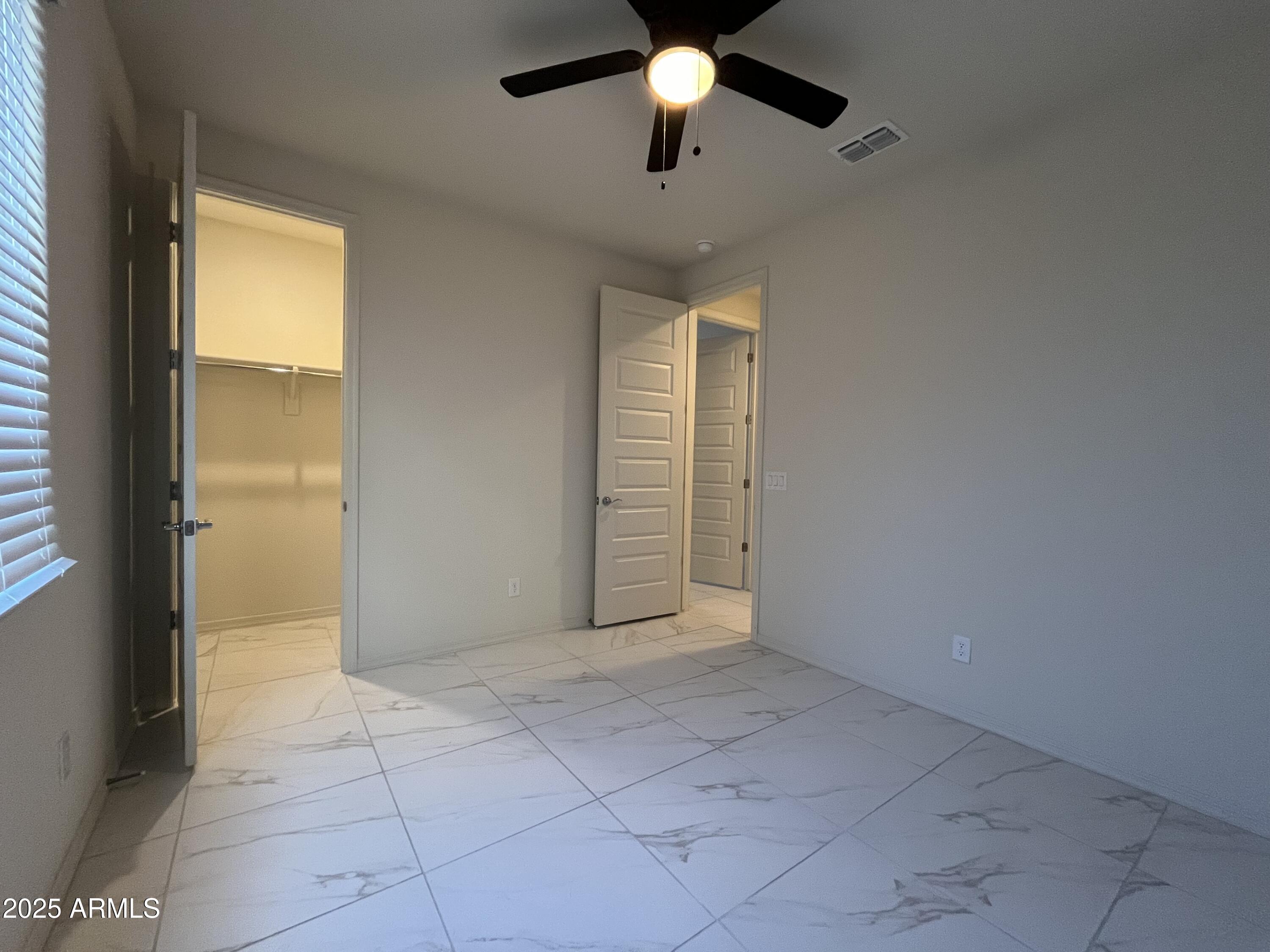 6970 West Gwen Street Laveen, AZ 85339 - Photo 19 of 30 a view of an empty room with a window