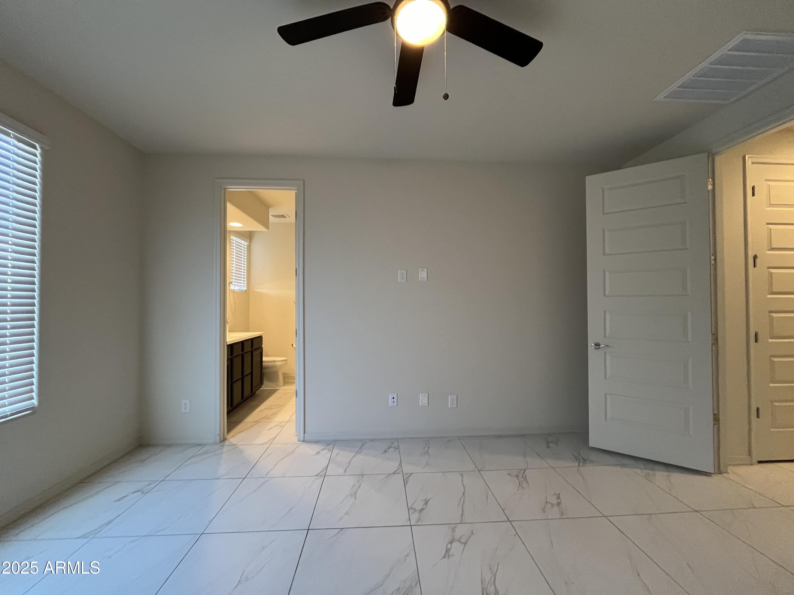 6970 West Gwen Street Laveen, AZ 85339 - Photo 21 of 30 a view of a livingroom with a chandelier fan and kitchen view