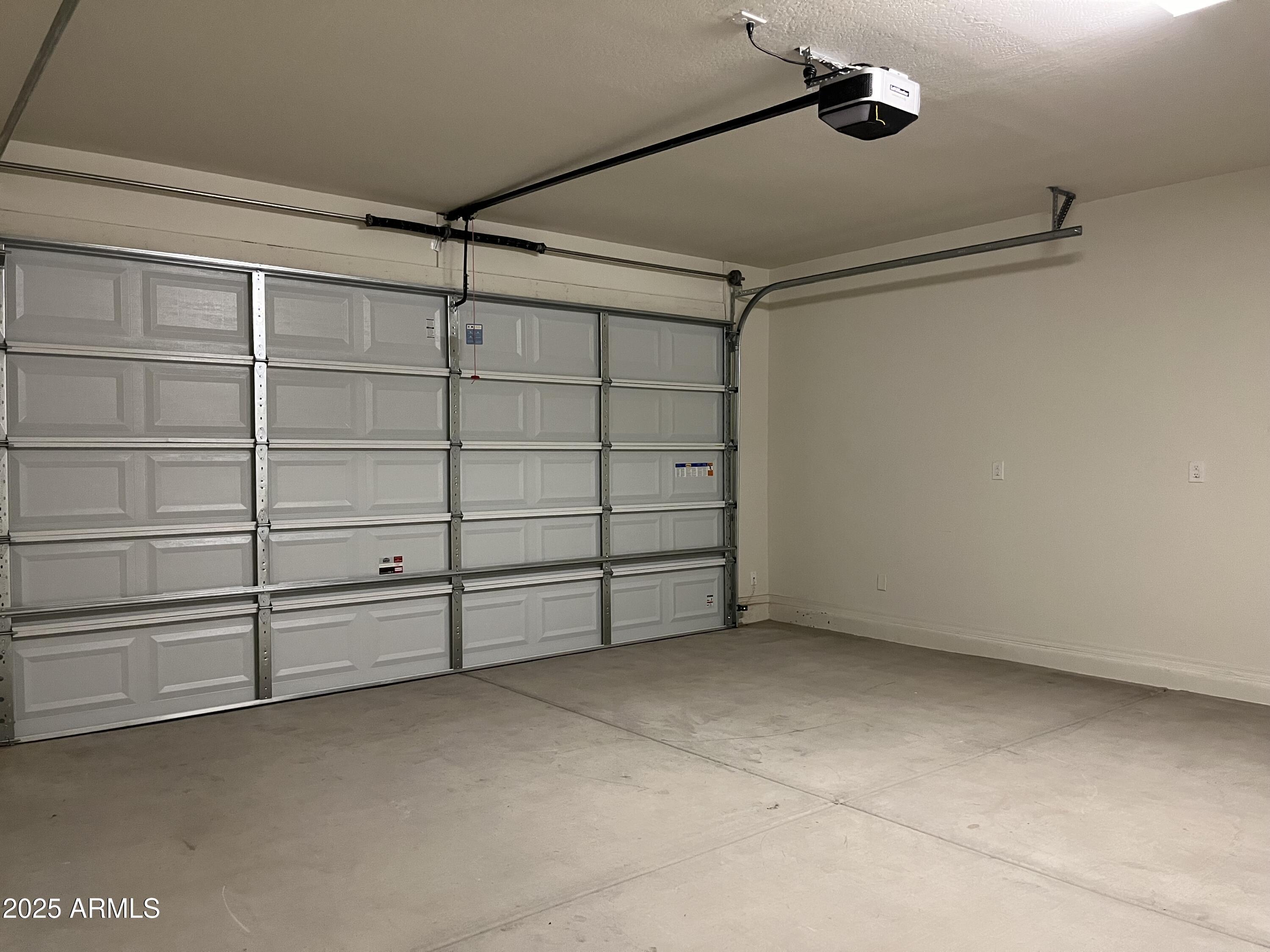 6970 West Gwen Street Laveen, AZ 85339 - Photo 27 of 30 a view of a room with storage and racks on the wall