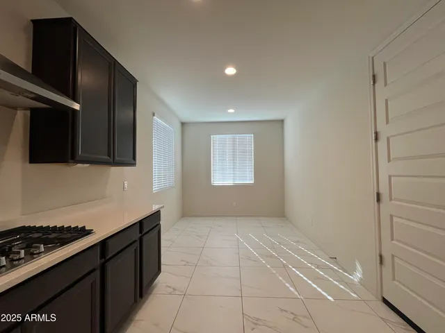 a kitchen with a stove and a microwave