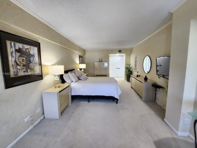 a bed room with a bed and window