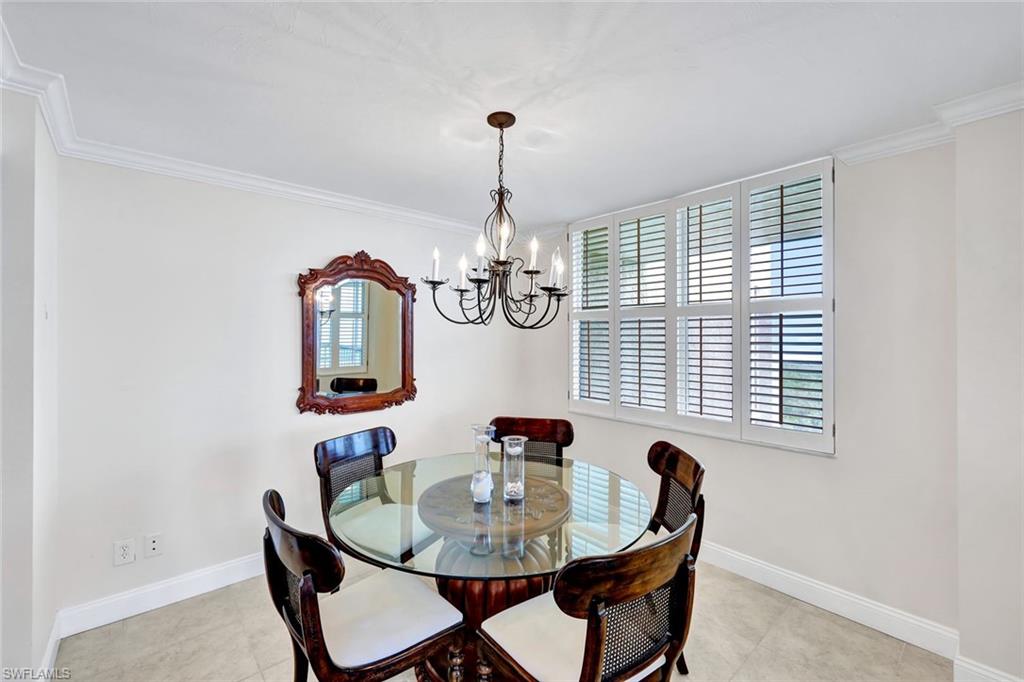 6573 Marissa Loop, Unit 2003 Naples, FL 34108 - Photo 12 of 41 a dining room with furniture and window