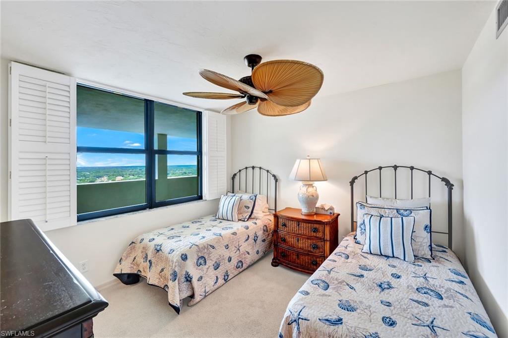 6573 Marissa Loop, Unit 2003 Naples, FL 34108 - Photo 18 of 41 a bedroom with bed and a window