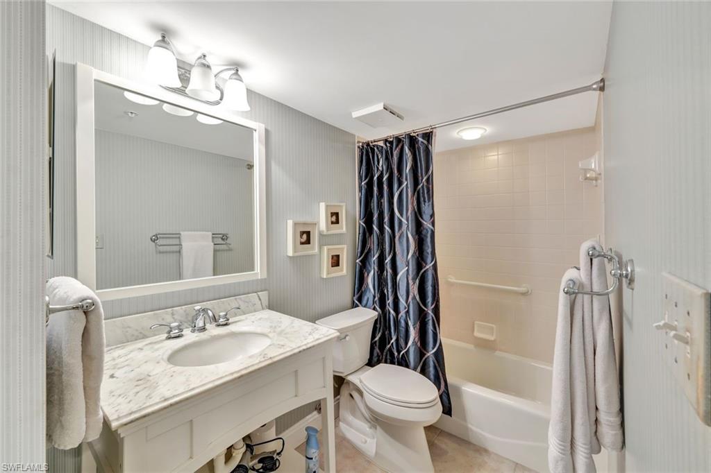 6573 Marissa Loop, Unit 2003 Naples, FL 34108 - Photo 19 of 41 a bathroom with a sink toilet and shower