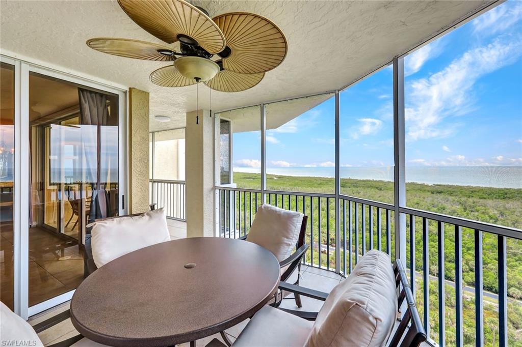 6573 Marissa Loop, Unit 2003 Naples, FL 34108 - Photo 20 of 41 a balcony with table and chairs